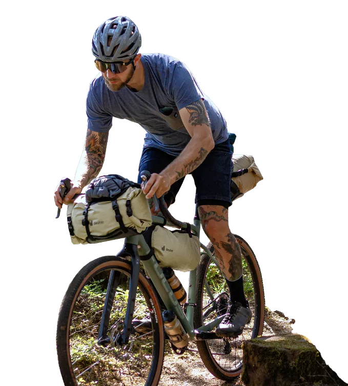 Cyclist crossing outdoor terrain